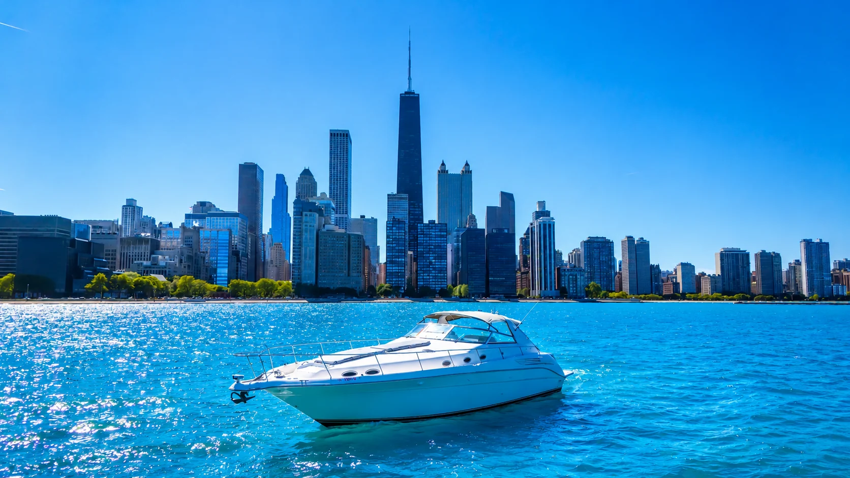 Private yacht on the bright blue waters of Lake Michigan with the Chicago skyline behind it